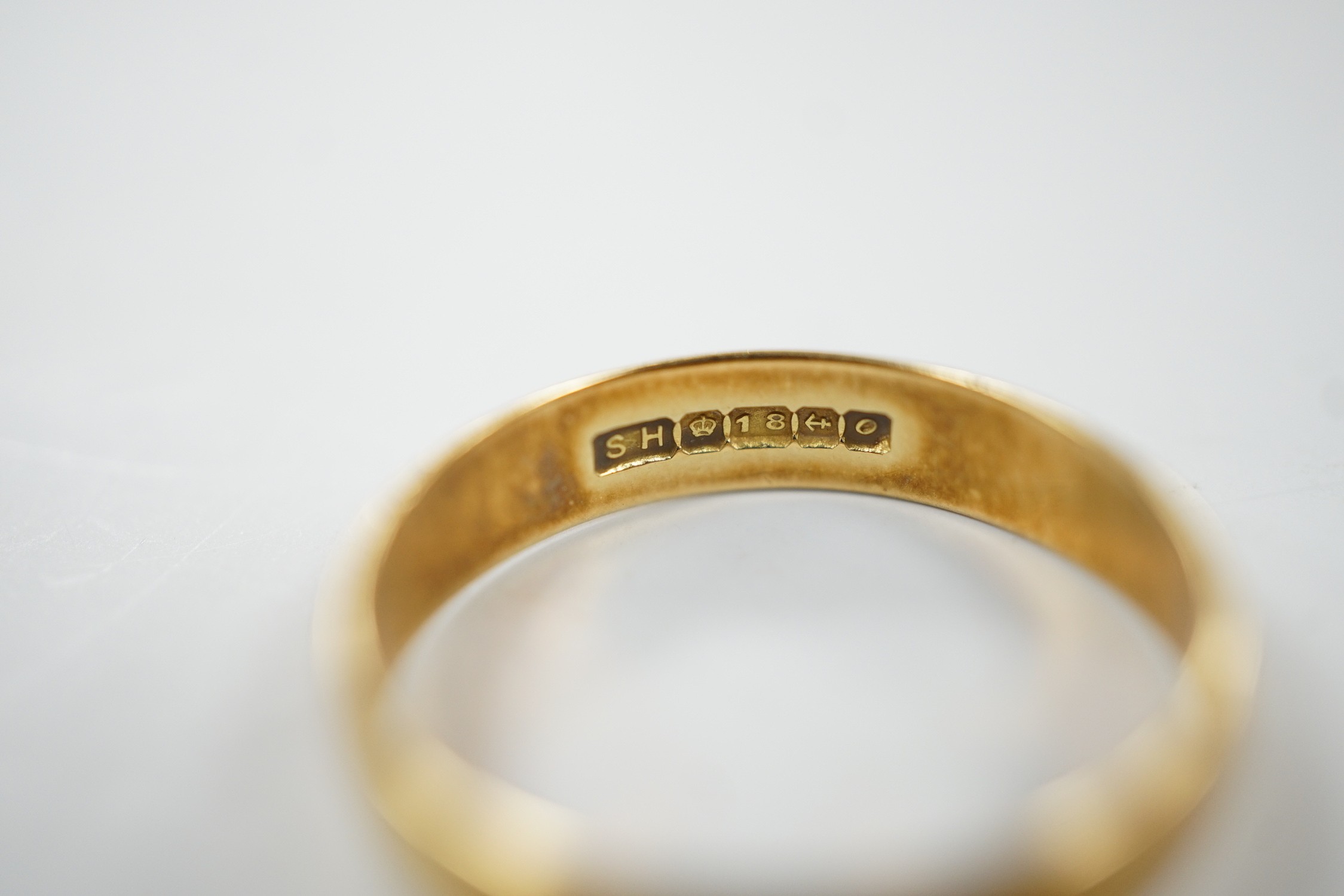 A 1960's 18ct gold wedding band, size P/Q, 3.3 grams, with engraved date to shank interior.